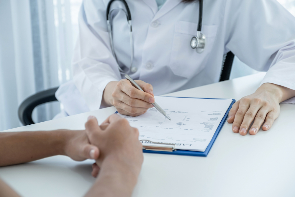 hand holding pen, Doctors report health examination results and recommend medication to patients, medical checkup concept.